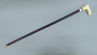 A walking stick with bone handle formed as an elephant. 91.5 cm long.