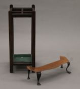 An early 20th century oak stick stand and a copper footman. The former 66 cm high.