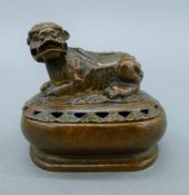 A bronze dog-of-fo lidded box. 6.5 cm long.