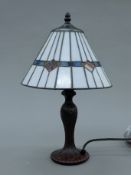 A Tiffany-style lamp. 41 cm high.