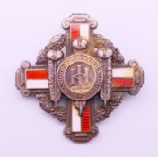 A boxed London Hospital School of Nursing silver and enamel nursing badge by John Pinches of London,