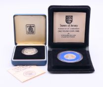 A boxed silver proof United Kingdom 1986 £1 coin and a boxed silver proof States of Jersey Parish