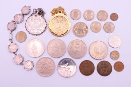 A quantity of various coins and coin set jewellery including a 1780 Maria Theresa Taler coin