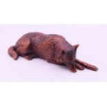A wooden model of a wolf. 10.5 cm long.