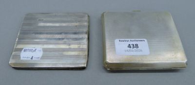 Two silver cigarette cases. The larger 9.5 cm wide. 242.4 grammes total weight.