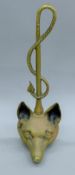 A brass fox mask door porter. 38 cm high.