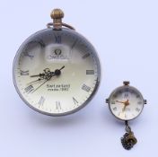 A ball clock and a pendant ball clock. 6.5 cm diameter and 2.5 cm diameter respectively.