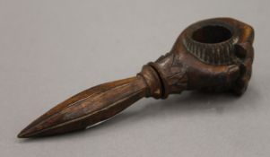 A 19th century treen hand-form nut cracker. 17.5 cm long.