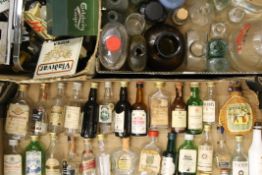 A quantity of alcohol miniature bottles, optics and various other bottles etc. The Bells bottle 9.