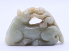 A jade horse with monkey on its back. 4.5 cm high.