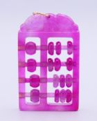 A pink tourmaline abacus pendant with gold suspension loop. 4.75 x 3 cm.