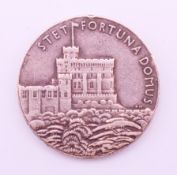 A silver Coronation coin.