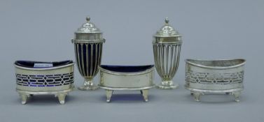 Three silver salts and two silver peppers (two liners lacking). The peppers each 9 cm high. 134.