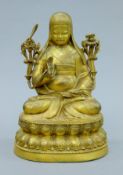 A gilt bronze model of Buddha. 23.5 cm high.