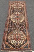 An antique Persian handmade Bakhtiari runner. 290 x 97 cm.