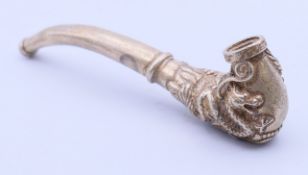 A Chinese white metal dragon pipe. 10 cm long.