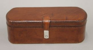 A leather-clad wristwatch box. 25.5 cm long.