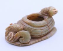 A jade koi carp brush washer. 4 cm high.