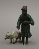 A cold-painted bronze model of a shepherd. 9.5 cm high.