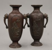 A pair of Meiji period Japanese bronze vases. Each 17.5 cm high.