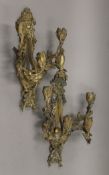 A pair of late 19th century gilt bronze four-branch wall sconces. Each 42.5 cm high.