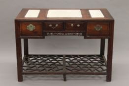 A Chinese marble-inset hardwood desk. 119 cm wide.