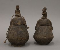 Two Baoule tribe carved wooden powder flasks. Each 17 cm high.