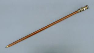 A walking stick, the handle formed as a telescope/compass. 99 cm long.