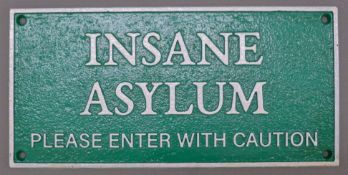 A cast iron 'Insane Asylum' sign. 27 cm wide.