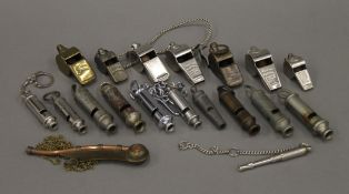 A collection of various vintage whistles, including Acme Thunderers, and Acme Guide whistle,