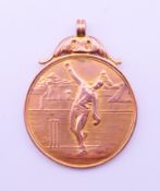 A 9 ct gold cricket fob inscribed H HAYMAN BOWLING 1922 S.G.C.C. 3 cm high. 8.4 grammes.