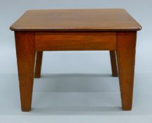 A 19th century mahogany stool. 22 cm wide x 16 cm high.