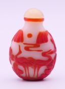 A 19th century Peking glass overlay snuff bottle. 6.5 cm high.