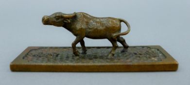 A bronze buffalo scroll weight. 9.5 cm long.