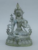 A Chinese bronze verdigris Buddha. 29 cm high.