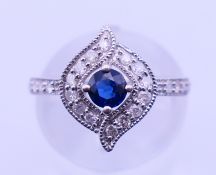 A 9 ct white gold, diamond and sapphire ring. Ring size K/L. 3 grammes total weight.