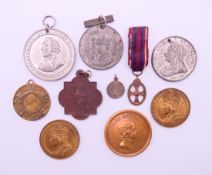 A collection of vintage medallions. The largest 4.5 cm diameter.