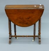 A small Victorian walnut Sutherland table. 52 cm long, 51 cm high.