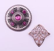 A boxed silver Ortak Celtic brooch and a boxed Ortak Pewter Collection brooch. The former 5 cm high.