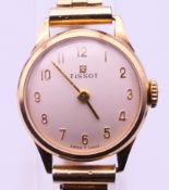 A boxed 9 ct gold-cased Tissot ladies' wristwatch,