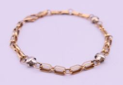A 9 ct bi-colour gold bracelet. 18 cm long. 5.6 grammes.