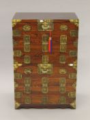 A Korean brass-mounted two-section cabinet. 60 cm wide, 89.5 cm high.