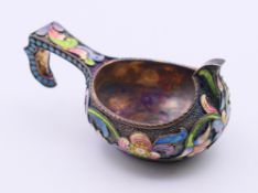 A silver and enamel kovsh, bearing Russian marks. 7.5 cm long. 47.1 grammes total weight.