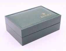 A vacant Rolex box. 16 wide, 11 cm deep, 5.75 cm high.