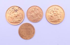 Two gold sovereigns (1903 and 1968) and two gold half sovereigns (1871 and 1911).