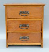 A late 19th/early 20th century small pine chest of drawers. 30 cm wide, 33 cm high.