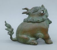 A Chinese bronze dog-of-fo censer. 20 cm long.