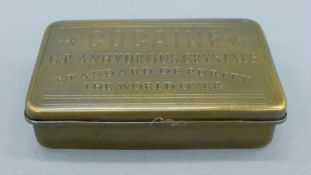A brass 'Cocaine' box. 13 cm wide.