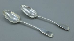 A pair of Victorian silver serving spoons. Each 22 cm long. 144 grammes.