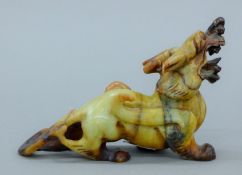 A Chinese hardstone dragon. 15 cm long.